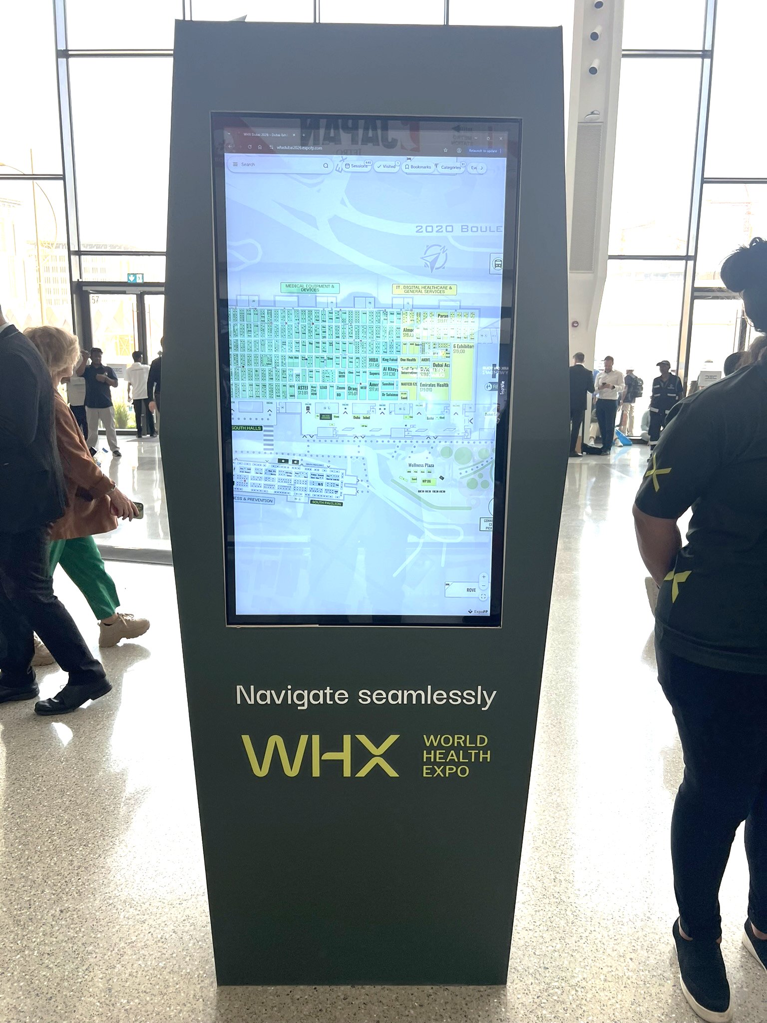 Digital wayfinding kiosk at WHX Dubai showing the interactive floor map